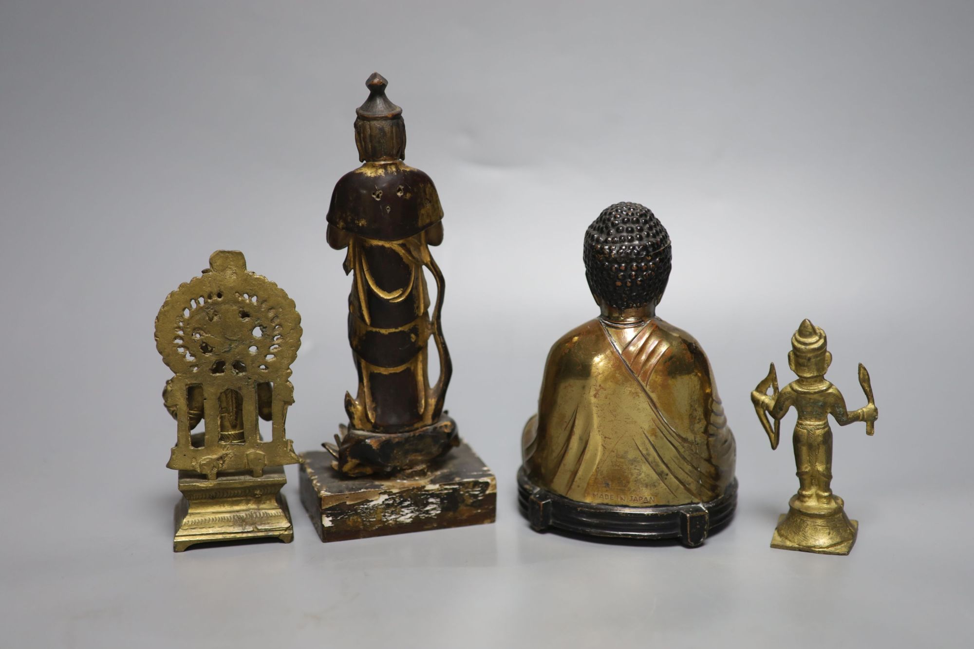 A Japanese gilt lacquered standing Buddha, a gilt copper Buddha and two Indian figures, tallest 21cm